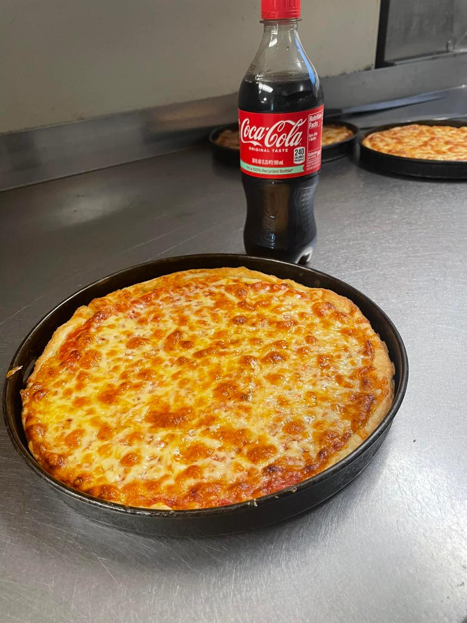 Fresh cheese pizza from the oven